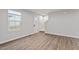 Living room with hardwood floors, stairs and a front door with a window at 1423 Bridgewater Dr, Durham, NC 27704