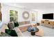 Inviting basement area with a comfortable sectional, wall decor, and ample natural light at 1546 Crescent Townes Way, Raleigh, NC 27604