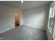 Carpeted bedroom with natural light, and an attached bathroom at 1546 Crescent Townes Way, Raleigh, NC 27604