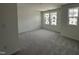 Carpeted bedroom with bright windows at 1546 Crescent Townes Way, Raleigh, NC 27604