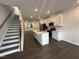 Bright, modern kitchen with white cabinets, stainless steel appliances, and an island with a sink at 1546 Crescent Townes Way, Raleigh, NC 27604