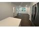 Open-concept living room with natural light, hardwood floors, and access to the backyard at 1546 Crescent Townes Way, Raleigh, NC 27604