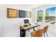 Bright office featuring a modern desk, stylish chairs, and large windows with a scenic outdoor view at 1546 Crescent Townes Way, Raleigh, NC 27604