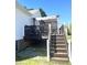 Back deck featuring stairs and sun shade canopy, perfect for relaxing at 1721 Daniels Farm Rd, Mebane, NC 27302