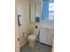 Cozy bathroom with tile flooring, cabinet storage, and coordinated towels at 1721 Daniels Farm Rd, Mebane, NC 27302