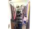 Walk-in closet with built-in shelving and ample storage for clothes and accessories at 1721 Daniels Farm Rd, Mebane, NC 27302