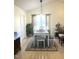 Bright dining room with large window and traditional-style table set at 1721 Daniels Farm Rd, Mebane, NC 27302