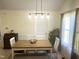 The dining room is bright, featuring a modern light fixture, stylish seating, and natural light at 1721 Daniels Farm Rd, Mebane, NC 27302