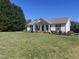 Charming home with a well-manicured front yard, green shutters, covered front porch and classic curb appeal at 1721 Daniels Farm Rd, Mebane, NC 27302