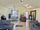 Open-concept kitchen and living room with natural light and stainless steel appliances at 1721 Daniels Farm Rd, Mebane, NC 27302
