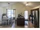 Bright kitchen with an island, stainless steel appliances, and an adjacent dining area at 1721 Daniels Farm Rd, Mebane, NC 27302