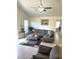 Cozy living room features stylish sectional sofa and an abundance of natural light at 1721 Daniels Farm Rd, Mebane, NC 27302