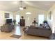 Open-concept living room with a comfortable sectional and natural lighting at 1721 Daniels Farm Rd, Mebane, NC 27302