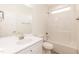 Bright bathroom features a white vanity, sink, toilet, shower, and tub combination at 175 David Ln, Roxboro, NC 27573