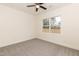 Carpeted bedroom with neutral walls, ceiling fan, and a bright window offering pleasant natural light at 175 David Ln, Roxboro, NC 27573
