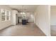 Open-concept kitchen featuring white cabinets, stainless steel appliances, and a stylish navy blue island with granite countertops at 175 David Ln, Roxboro, NC 27573