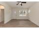 Spacious living room boasts wood-look floors, neutral walls, a modern ceiling fan, and a sunlit window at 175 David Ln, Roxboro, NC 27573