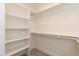 Organized walk-in closet with built-in shelving and ample storage space at 175 David Ln, Roxboro, NC 27573
