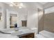 This bathroom features one sink, a large mirror, and a shower and bathtub combo at 1808 Pattersons Mill Rd, Durham, NC 27703