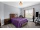 This bedroom features a queen size bed, a chair, and a television at 1808 Pattersons Mill Rd, Durham, NC 27703