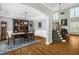 Dining room featuring hardwood floors and wainscotting, as well as an elegant light fixture at 1808 Pattersons Mill Rd, Durham, NC 27703