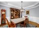 Formal dining room featuring a large hutch and modern lighting fixture at 1808 Pattersons Mill Rd, Durham, NC 27703