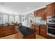 Well-designed kitchen with island, modern appliances, and adjacent dining area for seamless entertaining at 1808 Pattersons Mill Rd, Durham, NC 27703