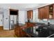 Modern kitchen features stainless steel refrigerator, center island, and ample cabinet space for storage at 1808 Pattersons Mill Rd, Durham, NC 27703