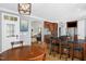 Open kitchen with granite counters, stainless appliances, and a breakfast bar adjacent to dining area at 1808 Pattersons Mill Rd, Durham, NC 27703
