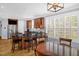 Spacious kitchen boasts a center island with seating, dark countertops, and stainless steel appliances at 1808 Pattersons Mill Rd, Durham, NC 27703