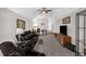 Spacious living room featuring vaulted ceilings, a ceiling fan, and comfortable leather furniture at 1808 Pattersons Mill Rd, Durham, NC 27703
