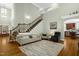 Inviting living room features a staircase, cozy seating, and hardwood flooring for a comfortable space at 1808 Pattersons Mill Rd, Durham, NC 27703