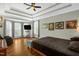 Serene main bedroom offers tray ceilings, natural light, and hardwood floors for relaxation at 1808 Pattersons Mill Rd, Durham, NC 27703