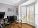 This office features a large bay window with great natural light, a desk, and a chair at 1808 Pattersons Mill Rd, Durham, NC 27703