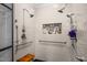 This shower features multiple shower heads, a built-in niche, and a handrail at 1808 Pattersons Mill Rd, Durham, NC 27703