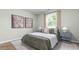 Cozy bedroom with comfortable bed, stylish wall art, and natural light, creating a relaxing atmosphere at 1914 Malvina Ct, Graham, NC 27253
