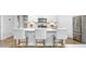 Beautiful kitchen featuring stainless appliances, white cabinetry, and a large island with barstool seating at 1914 Malvina Ct, Graham, NC 27253
