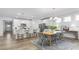 Open concept kitchen and dining area combination with stainless appliances and seating at the island at 1914 Malvina Ct, Graham, NC 27253
