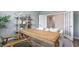 Comfortable office space with a wooden desk, comfortable seating, and decorative shelving at 1914 Malvina Ct, Graham, NC 27253