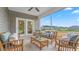 Relaxing screened-in patio with comfortable seating and a view of the landscaped backyard at 1914 Malvina Ct, Graham, NC 27253
