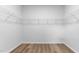 Spacious walk-in closet with white wire shelving system for optimal storage and organization at 1914 Malvina Ct, Graham, NC 27253