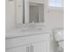 Bathroom featuring a vanity with quartz countertop, brushed nickel hardware, and low flow toilet at 1917 Malvina Ct, Graham, NC 27253