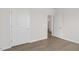Bright room with a doorway, white trim, light walls and wood-look floors at 1917 Malvina Ct, Graham, NC 27253