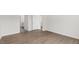 Clean bedroom design with wood flooring, a closet, and adjacent bathroom access at 1917 Malvina Ct, Graham, NC 27253