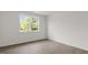 Cozy bedroom with a large window, wood-look flooring, and neutral walls at 1917 Malvina Ct, Graham, NC 27253