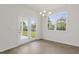 Bright dining area with access to the outdoor space, featuring wood-look floors at 1917 Malvina Ct, Graham, NC 27253