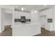 Kitchen featuring an island, quartz countertops, stainless steel appliances, pendant lighting and tile backsplash at 1917 Malvina Ct, Graham, NC 27253