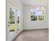 Inviting dining area with backyard views through glass doors and a large window at 1917 Malvina Ct, Graham, NC 27253