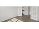 A bright office space with stylish French doors and wood-look flooring, flowing into the kitchen at 1917 Malvina Ct, Graham, NC 27253
