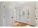Bright foyer featuring wood floors and a decorative glass front door at 198 Hillsdale Dr, Archer Lodge, NC 27527